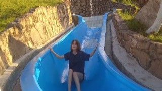 my stupid fake sister gets stuck on the pool slide and i take the opportunity to destroy her wildly.