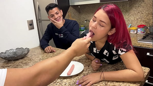 In front of her Silly Husband the Wife Sucks the Sausage that her Friend gives her in a Depraved way She cannot control the pleasure of becoming a NTR Whore