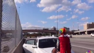 gibby the clown plows juicy tee on atlanta s most popular highway